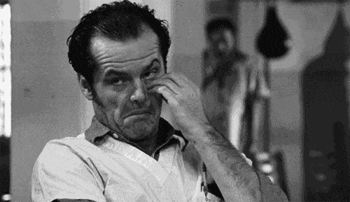 Black and white GIF of a man with slicked-back hair wearing a collared shirt, rubbing his eye with one hand, and making an exaggerated facial expression. He is seated, and there is a boxing bag and another person in the blurred background. - Choice Hacking Academy Black and white GIF of a man with slicked-back hair wearing a collared shirt, rubbing his eye with one hand, and making an exaggerated facial expression. He is seated, and there is a boxing bag and another person in the blurred background.