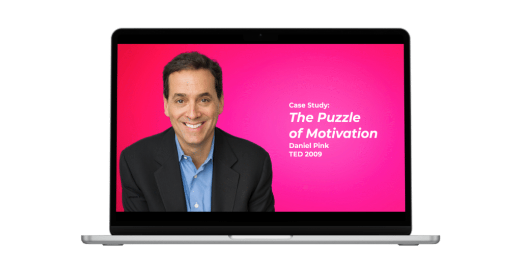 A laptop screen displays a presentation titled "Case Study: The Puzzle of Motivation" by Daniel Pink, TED 2009. On the left side of the screen is an image of a smiling man in a dark blazer and blue shirt against a bright pink background.