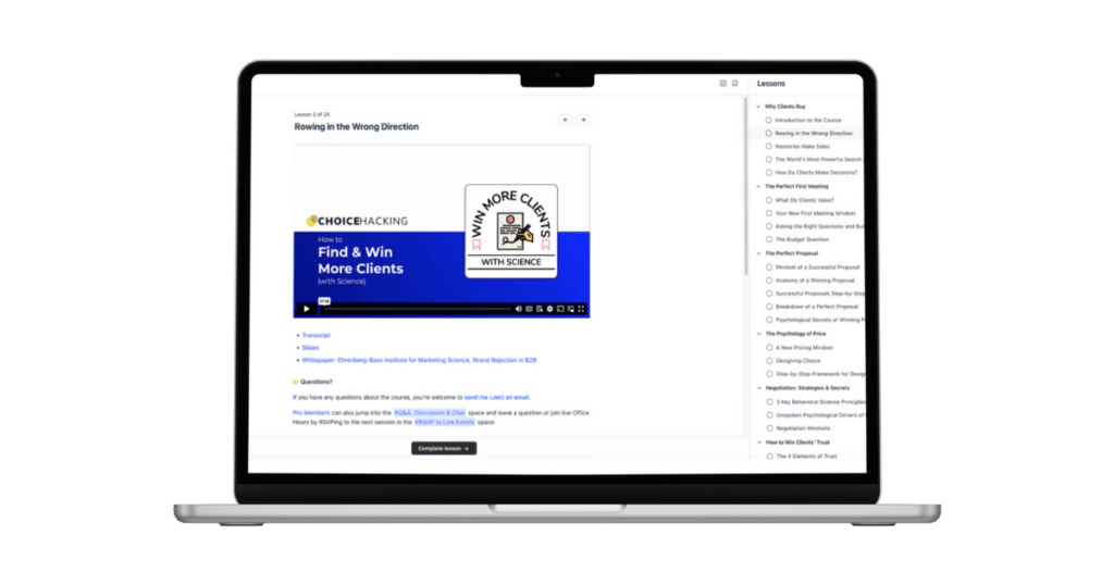 A laptop displaying an online course interface titled "Find & Win More Clients," by Justin Rondeau. The screen shows lesson titles on the right side and a video player on the left with an illustrated logo and text.
